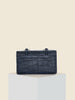 The Florence East West tophandle and crossbody bag back pocket